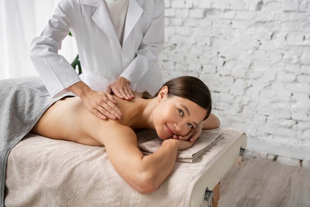 side-view-woman-getting-massaged-spa_23-2149871301.jpg