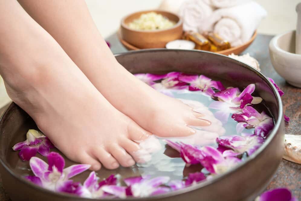 spa-treatment-product-female-feet-hand-spa-orchid-flowers-ceramic-bowl_1150-37717.jpg