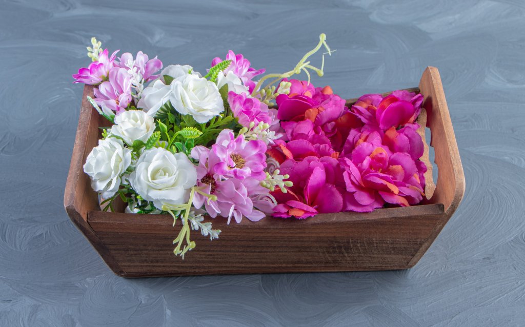 various-flowers-box-white-table.jpg